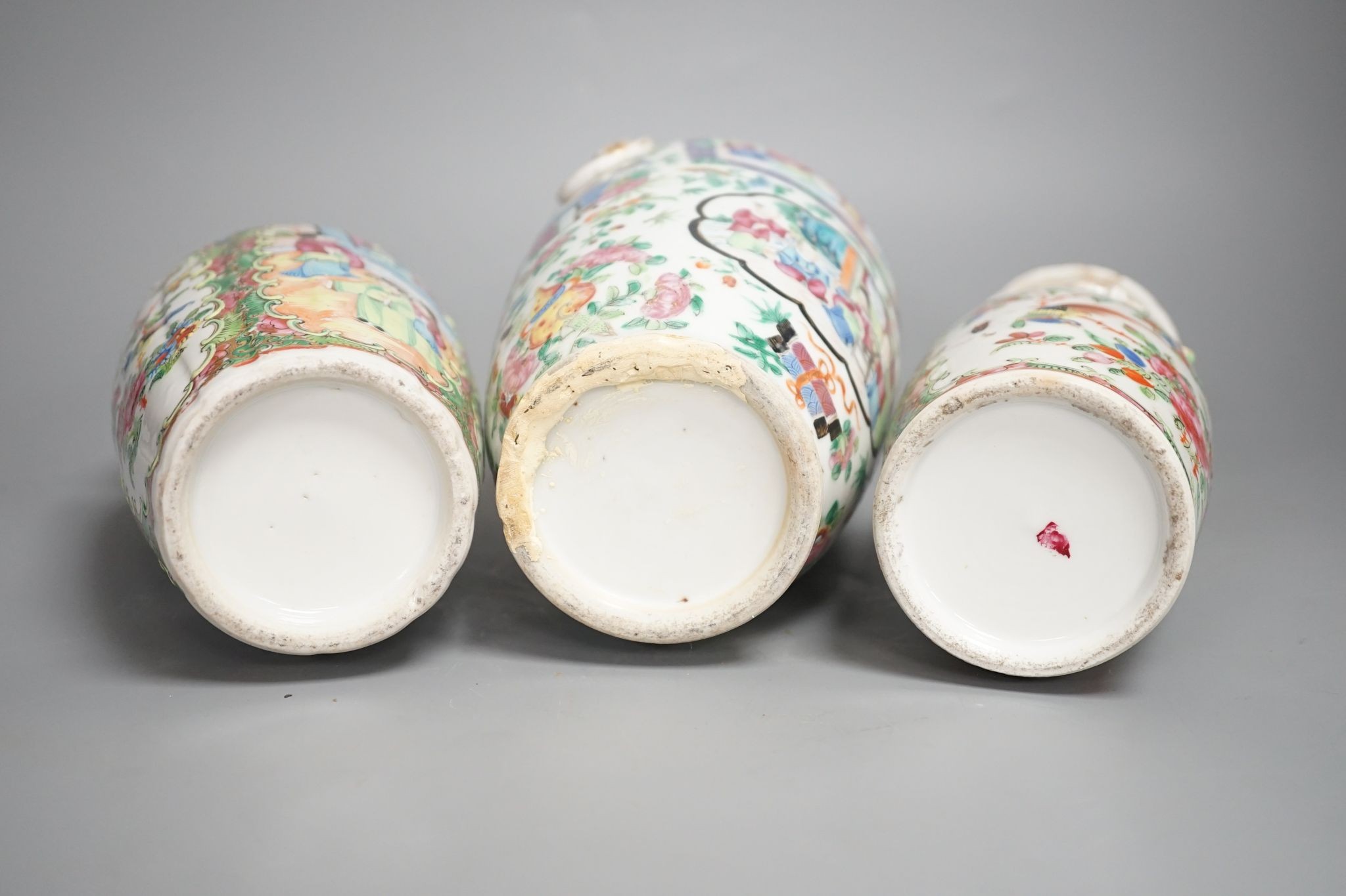 Three 19th century Chinese famille rose vases, Tallest 25 cms high.